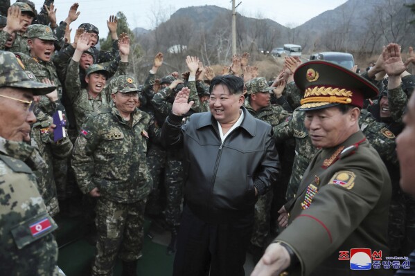 This photo provided by the North Korean government, North Korean leader Kim Jong Un, center, is surrounded by solders during his visit to his top tank group, the Seoul Ryu Kyong Su Guards 105th Tank Division, in North Korea on March 24, 2024. Independent journalists were not given access to cover the event depicted in this image distributed by the North Korean government. The content of this image is as provided and cannot be independently verified. Korean language watermark on image as provided by source reads: "KCNA" which is the abbreviation for Korean Central News Agency. (Korean Central News Agency/Korea News Service via AP)