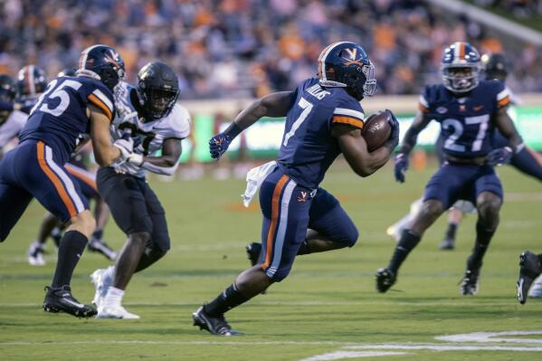 Virginia running back Mike Hollins (7) runs the ball against Wake Forest during an NCAA college football game Friday, Sept. 24, 2021, in Charlottesville, Va. (Erin Edgerton/The Daily Progress via AP)