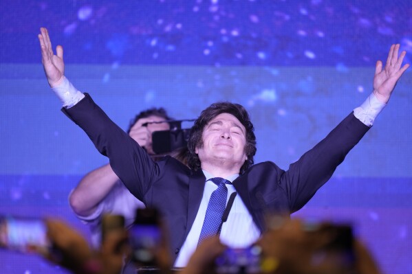 Javier Milei, presidential candidate of the Liberty Advances coalition, acknowledges supporters after voting closed in the primary election, in Buenos Aires, Argentina, Sunday, Aug. 13, 2023. The 52-year-old anti-establishment candidate received the biggest share of votes for presidential candidates in the October general election that will determine the country's next president. (AP Photo/Natacha Pisarenko)