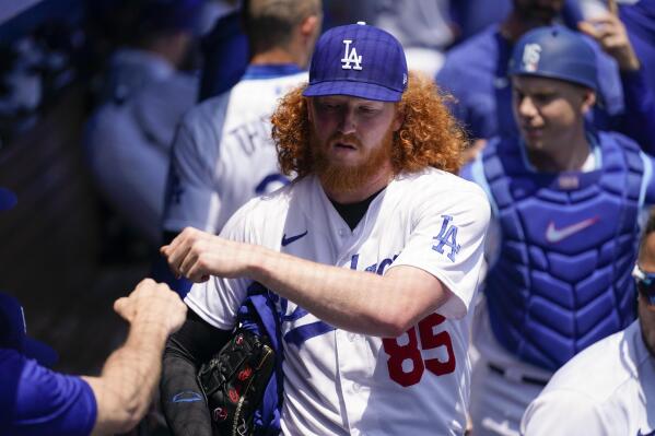 Los Angeles Dodgers starting pitcher Dustin May (85) walks through the dugout before a baseball game against the Minnesota Twins in Los Angeles, Wednesday, May 17, 2023. (AP Photo/Ashley Landis)