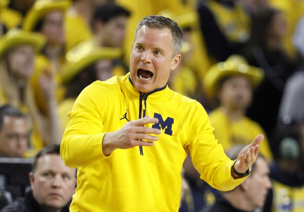 Michigan agrees to multiyear contract extension with coach Dusty May during  successful debut season | AP News