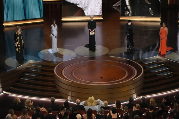 Mary Steenburgen, from left, Lupita Nyong'o, Jamie Lee Curtis, Rita Moreno, and Regina King present the award for best performance by an actress in a supporting role during the Oscars on Sunday, March 10, 2024, at the Dolby Theatre in Los Angeles. (AP Photo/Chris Pizzello)