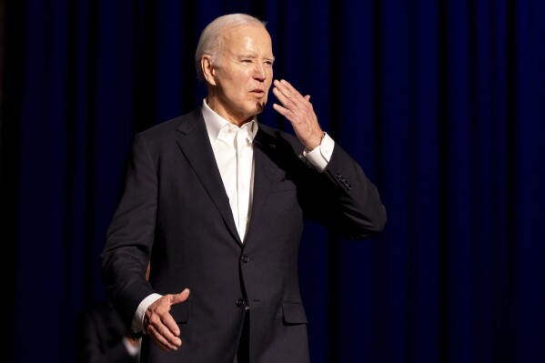 President Joe Biden blows a kiss as he arrives for a campaign event with former President Barack Obama moderated by Jimmy Kimmel at the Peacock Theater, Saturday, June 15, 2024, in Los Angeles. (AP Photo/Alex Brandon)
