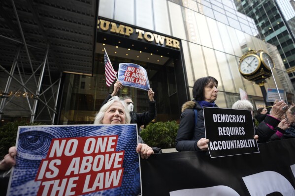 Protesters gather outside Trump Tower Friday, March 31, 2023, in New York.(AP Photo/Bryan Woolston, File)