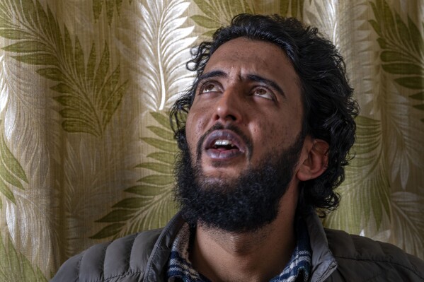 Fahad Shah, founder and editor of news portal The Kashmir Walla, speaks with the Associated Press at his residence on the outskirts of Srinagar, Indian controlled Kashmir, Friday, Nov. 24, 2023. Indian authorities have released the prominent Kashmir journalist on bail nearly two years after he was arrested on accusations of publishing “anti-national content” and “glorifying terrorism.” (AP Photo/Dar Yasin)