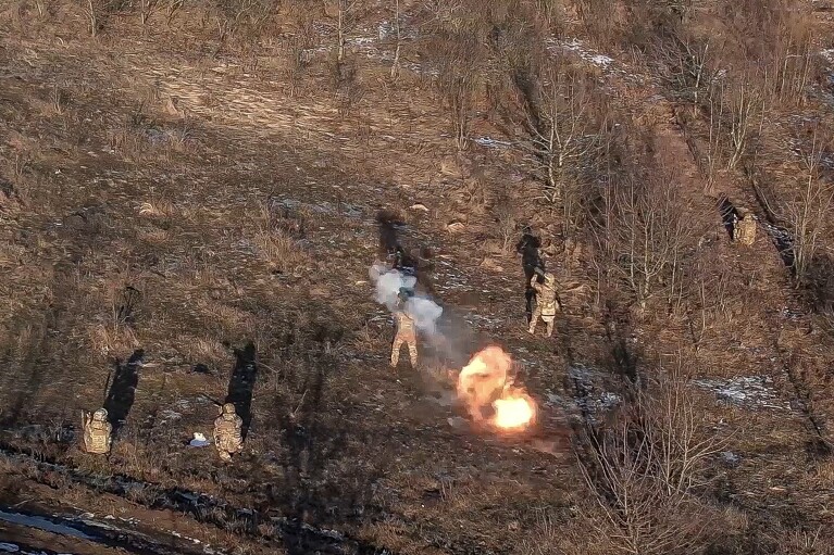 FILE - In this image released by the Russian Defense Ministry on April 9, 2024, Russian soldiers fire flamethrowers at Ukrainian positions in an undisclosed location in Ukraine. (Russian Defense Ministry Press Service via AP, File)