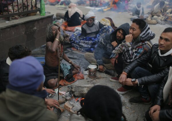 A Hindu holy man smokes marijuana during Shivaratri festival at the premises of Pashupatinath temple in Kathmandu, Nepal, Friday, Feb. 21, 2020. Hindu holy men were joined by devotees and the public Friday at a revered temple in Kathmandu where they lit up marijuana cigarettes during an annual festival despite prohibition and warning by authorities. Hindu holy men were joined by devotees and the public Friday at a revered temple in Kathmandu where they lit up marijuana cigarettes during an annual festival despite prohibition and warning by authorities. “There is a ban on smoking marijuana but at the same time it is centuries-old tradition which we have to respect,”said police officer Suman Khadka adding there was no arrests made Friday. (AP Photo/Niranjan Shrestha)