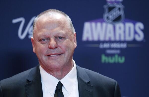 FILE - Gerard Gallant, head coach of the Vegas Golden Knights, poses on the red carpet before the NHL Awards in Las Vegas, in this Wednesday, June 20, 2018, file photo. Gallant takes on a new challenge as coach of the New York Rangers, looking to “take a big step” with a young team that ownership and management thinks should be a contender. It’s very different than his previous stints with expansion Vegas and Florida. (AP Photo/John Locher, File)