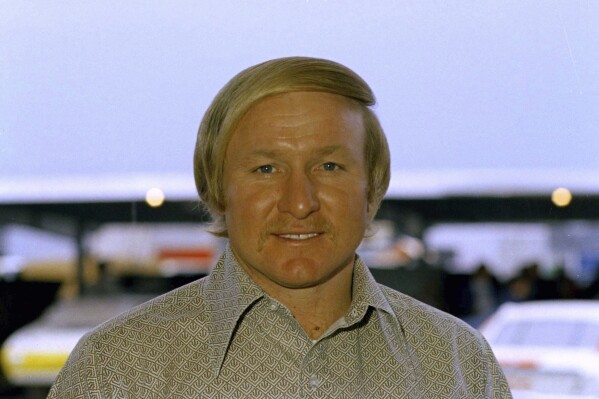 FILE - Cale Yarborough, stock car racer, is seen in this 1972 photo. Darlington Raceway will pay tribute to the late NASCAR Hall of Famer Cale Yarborough by displaying his No. 29 1988 Oldsmobile Cutlass during its throwback weekend at the Goodyear 400 in May. (AP Photo, File)