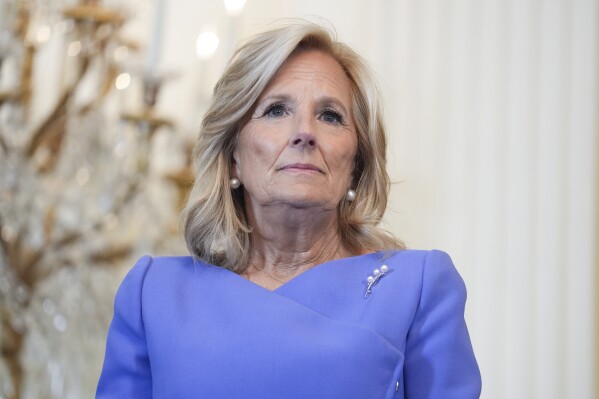 First lady Jill Biden arrives for a Women's History Month reception in the East Room of the White House, Monday, March 18, 2024, in Washington. (AP Photo/Evan Vucci)