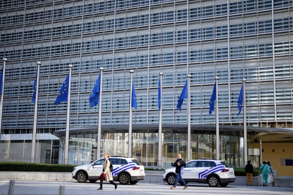 Police cars stand outside EU headquarters in Brussels, Sept. 30, 2022. (AP Photo/Virginia Mayo, file)