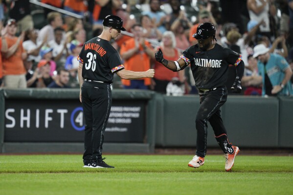 Orioles score six in ninth, hold on to beat Rays 9-6