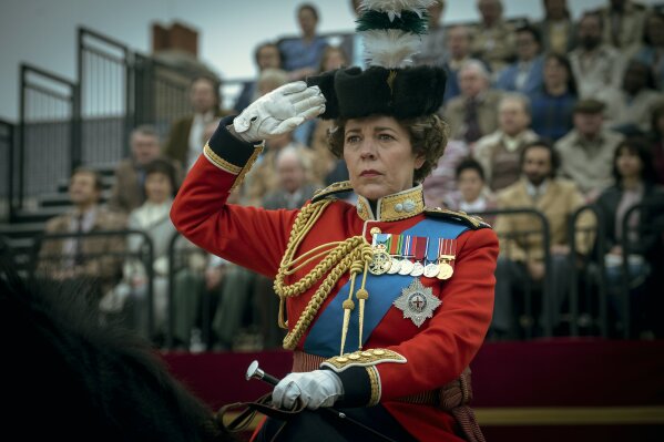 This image released by Netflix shows Olivia Colman as Queen Elizabeth II in a scene from "The Crown." The Screen Actors Guild has nominated the cast for a SAG Award for best ensemble in a drama series. (Liam Daniel/Netflix via AP)