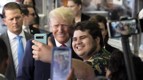 Former President Donald Trump poses for a photo as he visits Pat's King of Steaks in Philadelphia, Friday, June 30, 2023. (AP Photo/Matt Rourke)