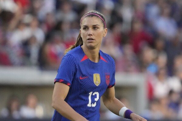 FILE - United States' Alex Morgan plays during the first half of an international friendly soccer match against Ireland Tuesday, April 11, 2023, in St. Louis. Morgan is one of the veterans selected Wednesday, June 21, 2023, for the United States team that will defend its title at the Women's World Cup next month.(AP Photo/Jeff Roberson, File)