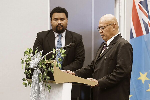 FILE - In this photo provided by the Tuvalu government, the newly elected Prime Minister Feleti Teo, right, is sworn into office during a ceremony in Funafuti, Tuvalu, on Feb. 28, 2024. Australia struck a new security deal with Tuvalu on Thursday, May 9, 2024, after critics complained that a previous pact created an Australian veto power over any other agreement the tiny South Pacific island nation pursued with a third country, such as China. (Tuvalu Government via AP, File)