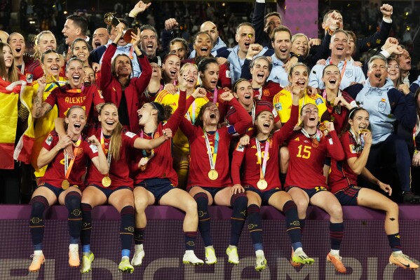 Spain's team celebrate with the trophy after the final of Women's World Cup soccer between Spain and England at Stadium Australia in Sydney, Australia, Sunday, Aug. 20, 2023. (AP Photo/Rick Rycroft)