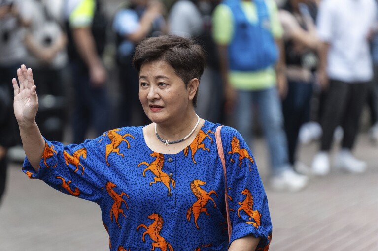 Former pro-democracy lawmaker Helena Wong arrives at the West Kowloon Magistrate's Court in Hong Kong on Thursday, May 30, 2024.  (AP Photo/Chan Long Hai)