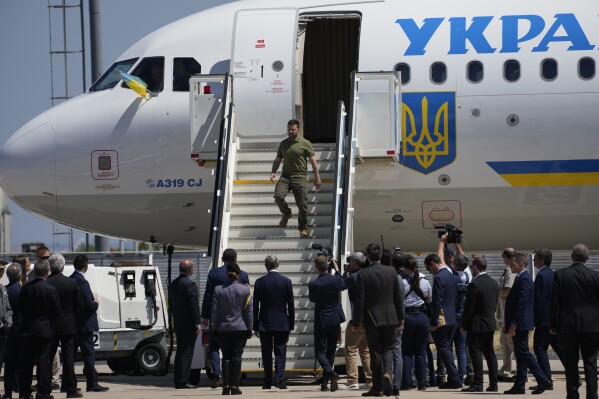 Ukrainian President Volodymyr Zelenskyy steps down from a plane on arrival at the military airport in Lisbon, Tuesday, May 28, 2024. (AP Photo/Armando Franca)