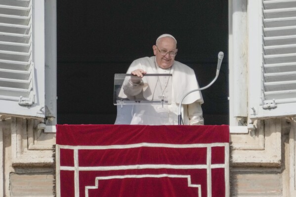 Pope Francis delivers the Angelus noon prayer from his studio's window overlooking St.Peter's Square, at the Vatican, Sunday, Jan. 14, 2024. (AP Photo/Gregorio Borgia)