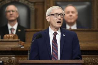 FILE - Wisconsin Gov. Tony Evers speaks during the annual State of the State address on Jan. 24, 2023, in Madison, Wis. Evers promised Thursday, May 4, 2023, to veto a wide-ranging Republican plan to bolster aid to local governments, saying the measure moving rapidly through the GOP-controlled Legislature doesn't give enough unrestricted money to communities struggling to pay for police, fire and other services. (AP Photo/Morry Gash, File)