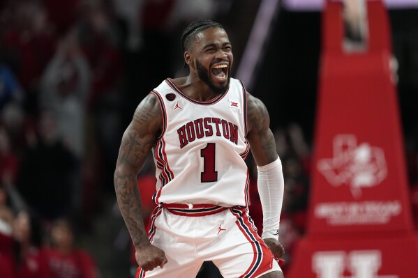 Houston's Jamal Shead (1) celebrates during the second half of an NCAA college basketball game against Iowa State Monday, Feb. 19, 2024, in Houston. Houston won 73-65. (AP Photo/David J. Phillip)