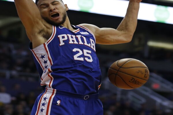 
              Philadelphia 76ers guard Ben Simmons (25) dunks against the Phoenix Suns in the second half during an NBA basketball game, Wednesday, Jan. 2, 2019, in Phoenix. The 76ers defeated the Suns 132-127. (AP Photo/Rick Scuteri)
            