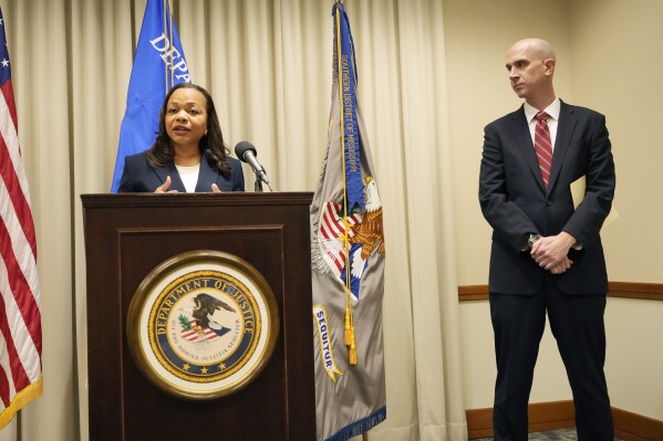 Assistant Attorney General Kristen Clarke of the U.S. Department of Justice Civil Rights Division announces at a news conference, Wednesday, Nov. 8, 2023, in Jackson, Miss., that it has opened an investigation into the City of Lexington, Miss., and the Lexington Police Department, focusing on the police department's use of force and its stops, searches and arrests. U.S. Attorney Todd W. Gee, for the Southern District of Mississippi, right, listens. (AP Photo/Rogelio V. Solis)