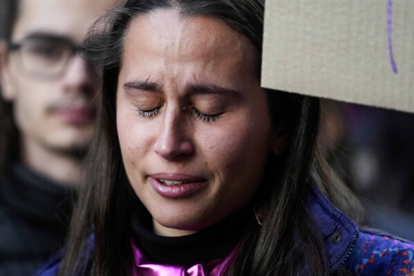 FILE - A student cries during a flash mob 'A minute of noise for Giulia' for Giulia Cecchettin, allegedly killed at the hands of her possessive ex-boyfriend, outside the Statale University, in Milan, Italy, Wednesday, Nov. 22, 2023. (AP Photo/Luca Bruno, file)