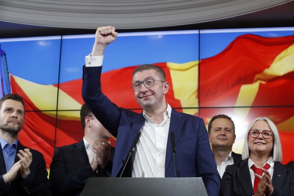 Hristijan Mickoski, the leader of the opposition center-right VMRO-DPMNE party celebrates after a news conference in Skopje, North Macedonia, on Wednesday, May 8, 2024. Citizens voted in North Macedonia on Wednesday in a parliamentary election and presidential runoff dominated by the country's slow path toward European Union membership and its sluggish economy. (AP Photo/Boris Grdanoski)