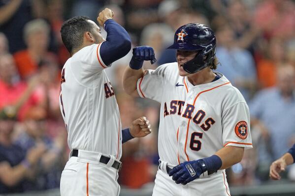 Houston Astros' Jake Meyers (6) celebrates with Carlos Correa after hitting a three-run home run against the Seattle Mariners during the second inning of a baseball game Monday, Sept. 6, 2021, in Houston. (AP Photo/David J. Phillip)