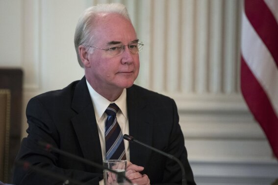 RETRANSMISSION TO CORRECT DATE - FILE - This Sept. 28, 2017, file photo shows then Secretary of Health and Human Services Tom Price attending an opioid roundtable discussion at the White House in Washington. Price is seeking a return ticket to Washington nearly two years after being ousted for excessive travel spending. He submitted an application to Georgia’s Republican Gov. Brian Kemp seeking appointment to the U.S. Senate, Kemp spokesman Cody Hall confirmed Thursday, Sept. 26, 2019. (AP Photo/Carolyn Kaster, File)