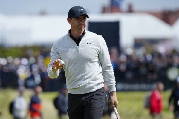 Northern Ireland's Rory McIlroy acknowledges the crowd after putting on the 6th green during the second day of the British Open Golf Championships at the Royal Liverpool Golf Club in Hoylake, England, Friday, July 21, 2023. (AP Photo/Jon Super)