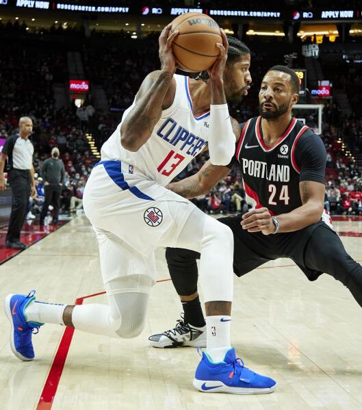 LOS ANGELES, CA - DECEMBER 03: Los Angeles Clippers Guard Paul George (13)  shoots a three pointer during a NBA game between the Portland Trail Blazers  and the Los Angeles Clippers on