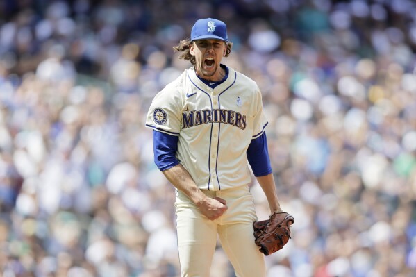 Seattle Mariners starting pitcher Logan Gilbert yells after striking out Texas Rangers' Leody Taveras for the final out for the Rangers in the eighth inning of in a baseball game, Sunday, June 16, 2024, in Seattle. (AP Photo/John Froschauer)