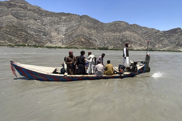 Rescuers search for survivors of sunken boat, in Mohmand Dara district of Nangarhar province east of Kabul, Afghanistan, Saturday, June 1, 2024. At least 20 people were killed when a boat sank while crossing a river in eastern Afghanistan Saturday morning, a Taliban official said. (AP Photo)