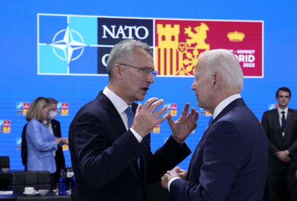 NATO Secretary General Jens Stoltenberg, left, speaks with U.S. President Joe Biden during a round table meeting at a NATO summit in Madrid, Spain on Wednesday, June 29, 2022. North Atlantic Treaty Organization heads of state will meet for a NATO summit in Madrid from Tuesday through Thursday. (AP Photo/Bernat Armangue)
