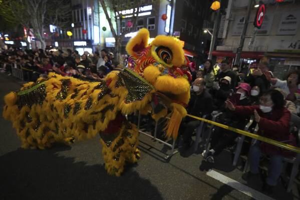 Participants wearing lion costumes perform in a parade during the Yeon Deung Hoe, or Lotus Lantern Festival, ahead of the Buddha's birthday on May 5, in downtown Seoul, South Korea, Saturday, April 26, 2025. (AP Photo/Lee Jin-man)