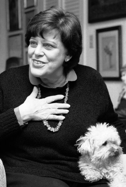 
              FILE - In this Feb. 27, 1984 file photo, actress Kaye Ballard appears with her dog, Big Shirley during an interview in her New York apartment. Marguerite Gordon, a friend of Ballard says the actress of the TV series “The Mothers-in-Law,” died Monday, Jan. 21, 2019, at her home in Rancho Mirage, Calif. she was 93. A boisterous comedian and singer as well as an actress, Ballard appeared in Broadway musicals and nightclubs from New York to Las Vegas.  (AP Photo/Suzanne Vlamis, File)
            