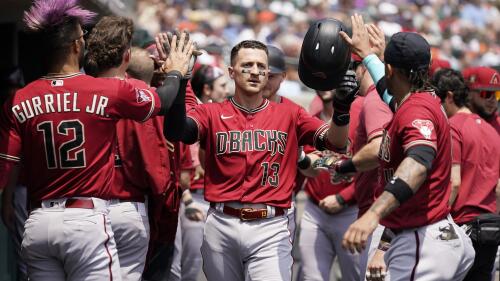 Arizona Diamondbacks' Nick Ahmed is greeted in the dugout after his two-run home run during the second inning of a baseball game against the Detroit Tigers, Saturday, June 10, 2023, in Detroit. (AP Photo/Carlos Osorio)