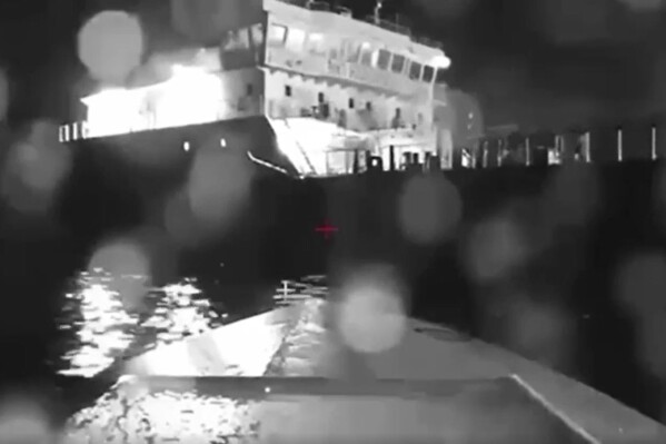 In this image from video made available on Saturday, Aug. 5, 2023, a seaborne drone approaches a Russian tanker on the Black Sea. Ukrainian drones have hit a Russian tanker in the Black Sea near Crimea, according to Russian officials. The strike was the second sea attack involving drones in one day, after Ukraine said its sea drones also struck a major Russian port earlier on Friday. (AP Photo)