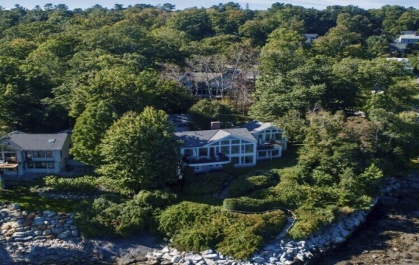 A cruise ship crosses Penobscot Bay, Tuesday, June 4, 2024, in off the coast of Camden, Maine. A homeowner poisoned a neighbor's trees to get a view of the scenic waterfront, sparking outrage in the community. (AP Photo/Robert F. Bukaty)