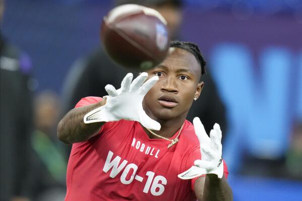 Boston College wide receiver Zay Flowers runs a drill at the NFL football scouting combine in Indianapolis, Saturday, March 4, 2023. (AP Photo/Michael Conroy)