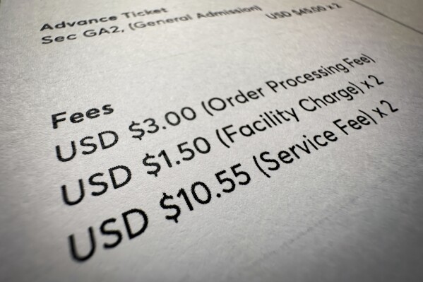 Fees on a concert ticket receipt are shown in this photo taken Wednesday, Nov. 1, 2023, in New York. "Junk fees" are just what they sound like: hidden or misleading charges that increase the total cost of concert tickets, hotel rooms, utility bills and other goods and services. (Ǻ Photo/John Minchillo)