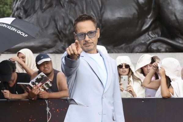 Robert Downey Jr. poses for photographers at the photo call for the film 'Oppenheimer' on Wednesday, July 12, 2023 in London. (Vianney Le Caer/Invision/AP)
