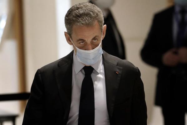 FILE - In this Nov.13, 2020 file photo, former French President Nicolas Sarkozy arrives at the courtroom Monday, Nov. 30, 2020 in Paris. . Sarkozy is set to go on trial on Thursday, May 20, 2021, on charges that his unsuccessful reelection bid was illegally financed. Sarkozy, is facing allegations that he spent almost twice the maximum legal amount of 22.5 million euros ($27.5 million) in his 2012 reelection bid, which he lost to Socialist Francois Hollande (AP Photo/Christophe Ena, File)