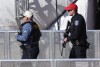 Law enforcement officials arrive to investigate after a shooting during the Super Bowl celebration of the NFL's Kansas City Chiefs in Kansas City, Missouri, Wednesday, Feb. 14, 2024. Multiple people were injured, a fire official said.  (AP Photo/Reed Hoffman) )