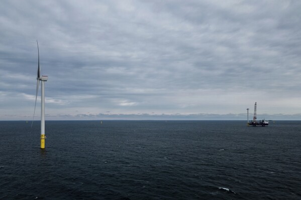 FILE - The first operating South Fork Wind farm turbine, Dec. 7, 2023, stands east of Montauk Point, N.Y. The Biden administration approved the seventh large offshore wind project in the United States on Tuesday, March 26, 2024. (AP Photo/Julia Nikhinson, File)