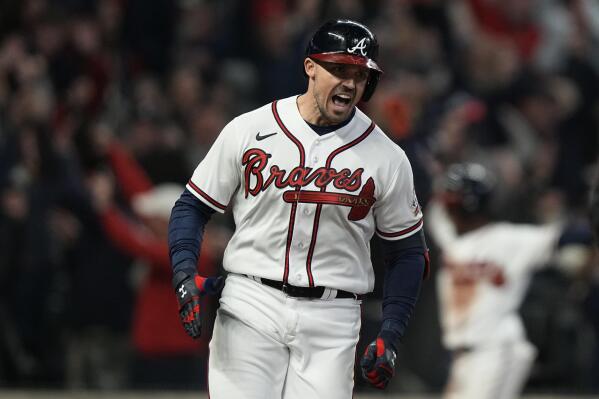 Atlanta Braves' Adam Duvall celebrates after his grand slam home run during the first inning in Game 5 of baseball's World Series between the Houston Astros and the Atlanta Braves Sunday, Oct. 31, 2021, in Atlanta. (AP Photo/Brynn Anderson)