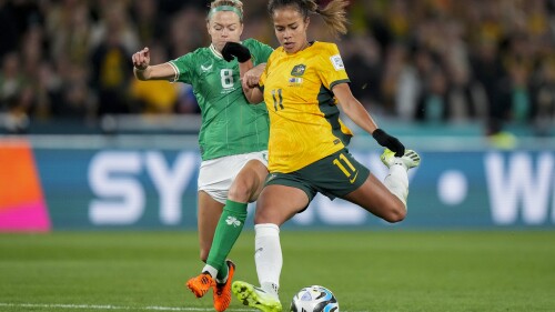 Australia's Mary Fowler, right, vies for the ball with Ireland's Ruesha Littlejohn during the Women's World Cup soccer match between Australia and Ireland at Stadium Australia in Sydney, Australia, Thursday, July 20, 2023. (AP Photo/Rick Rycroft)